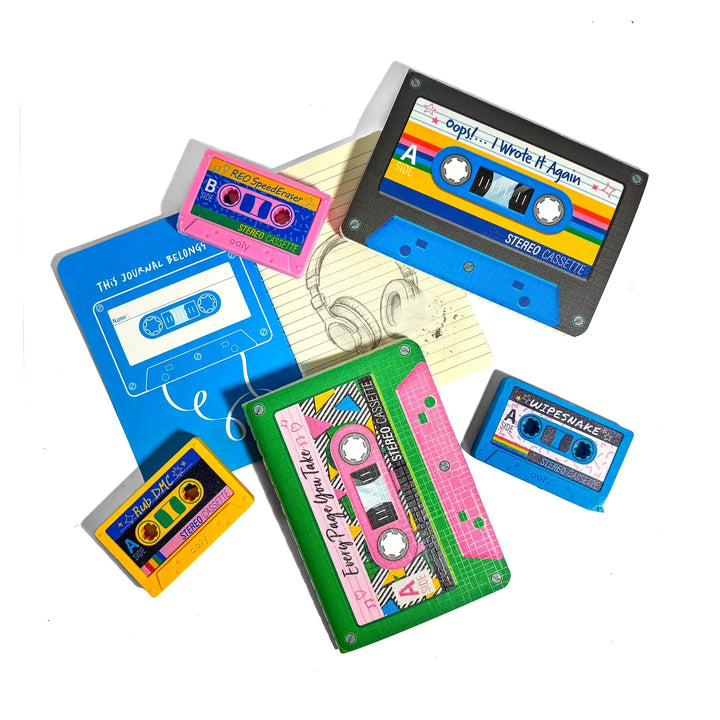 A flat lay of retro cassette tape illustrations and album-cover-style labels on a white background, including one blue cassette with rainbow stripes, a green cassette with pink panels, a blue sleeve, and smaller colorful label designs.
