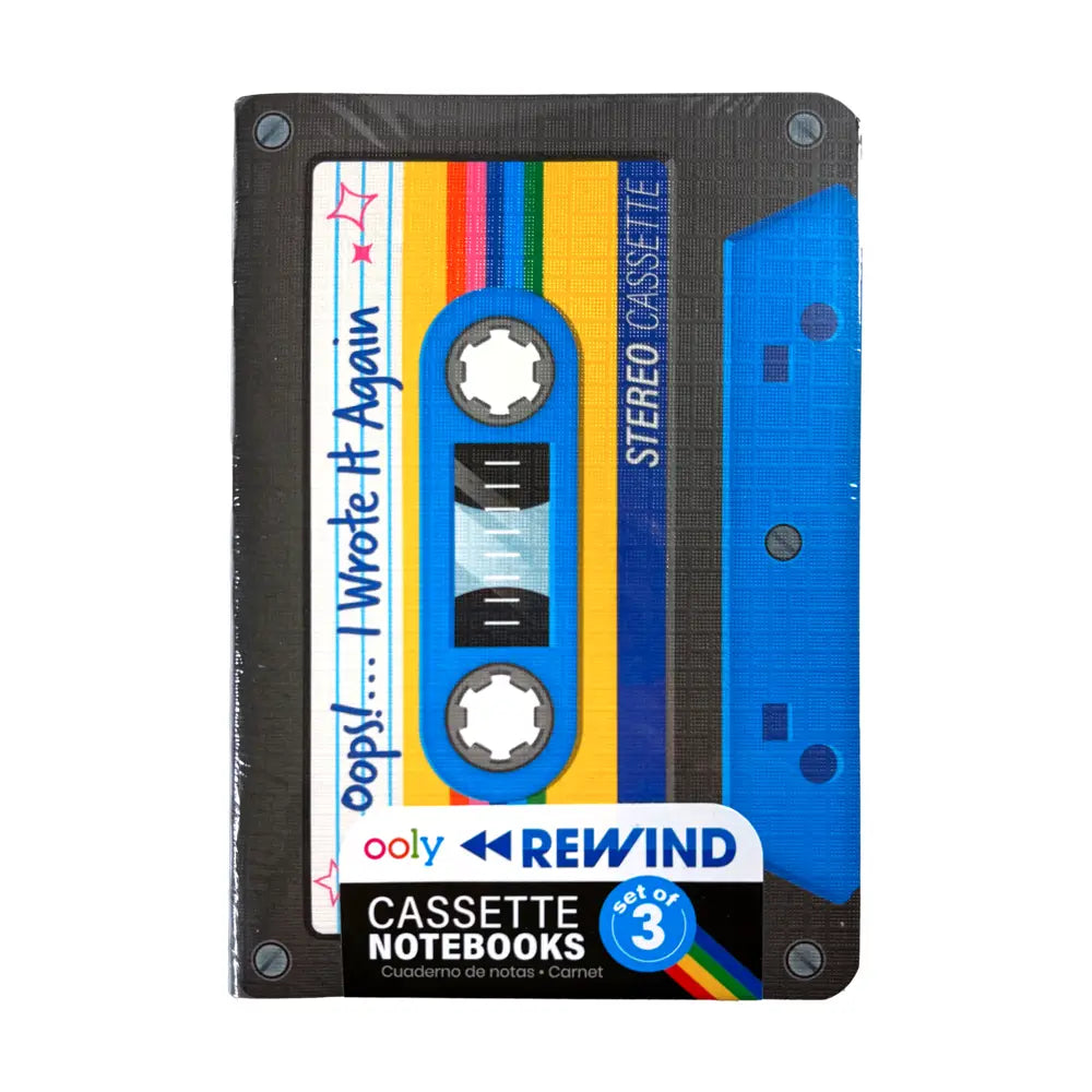 A cassette-shaped notebook cover from ooly REWIND, featuring a retro 1980s cassette tape design with blue, yellow, and rainbow colors on a white background.