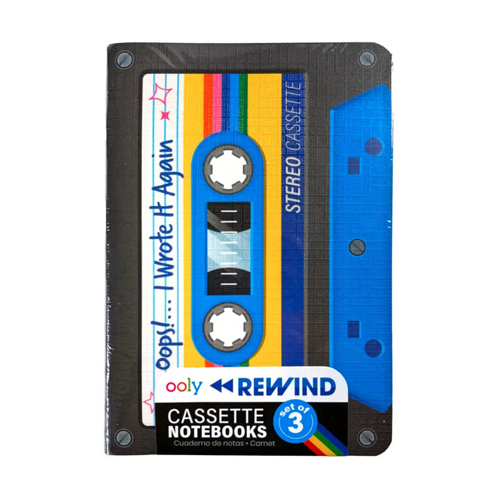 A cassette-shaped notebook cover from ooly REWIND, featuring a retro 1980s cassette tape design with blue, yellow, and rainbow colors on a white background.
