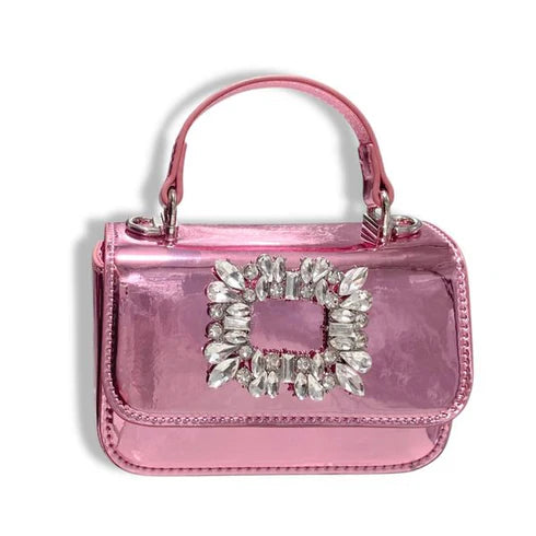 Pink metallic handbag with a decorative rhinestone clasp on a white background