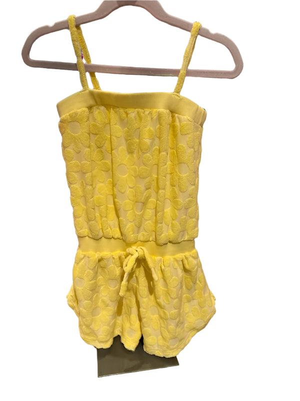 yellow terry cloth romper, spaghetti straps, shorts and elastic waist. daisy embellishment on the romper. 