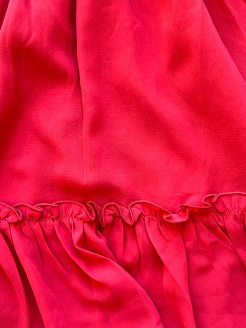 Close-up of a red fabric with a ruffled edge