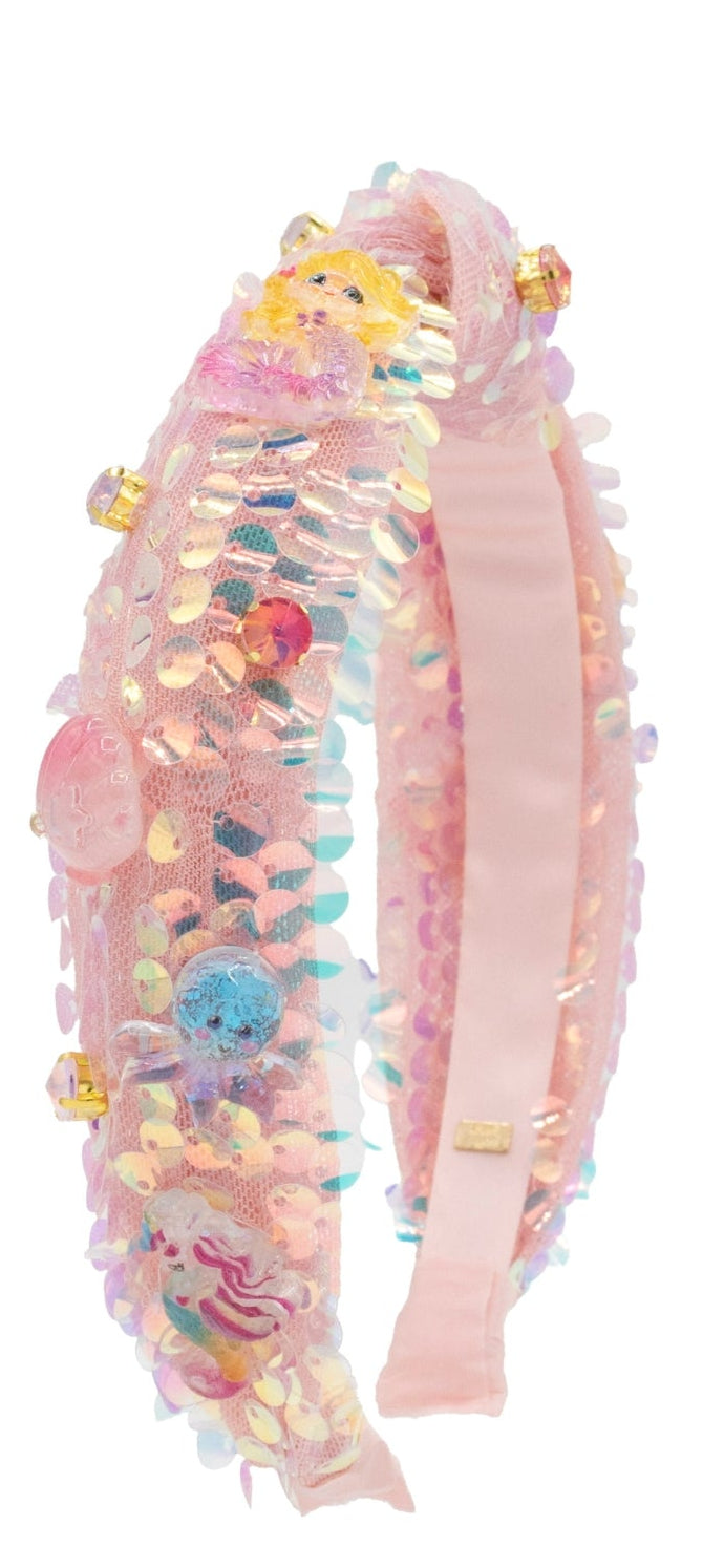 pink Decorative headband with colorful embellishments on a white background
