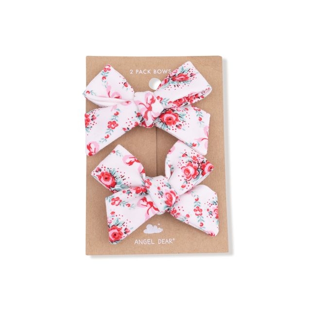 Two floral hair bows on a cardboard backing with 'Angel Dear' branding.