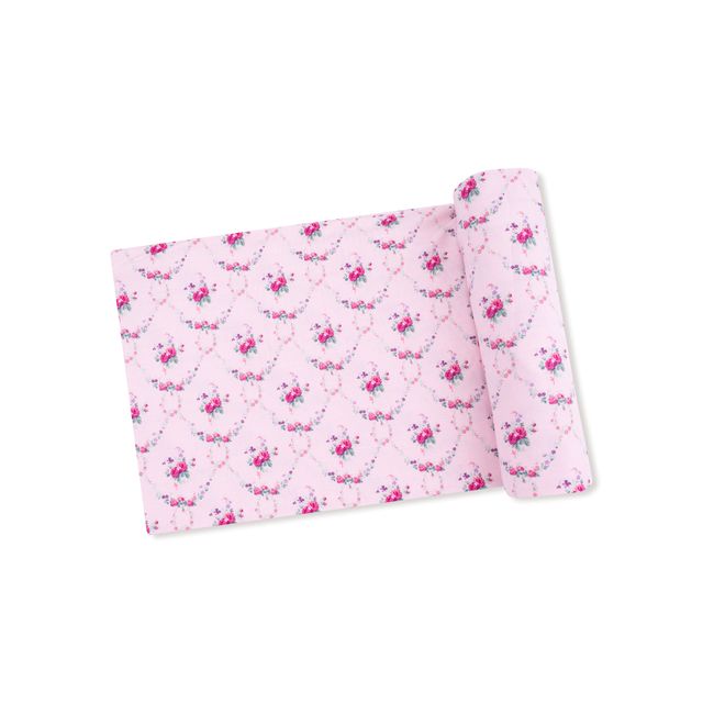 baby swaddle in light pink with tiny pink and purple florals all over the swaddle. 
