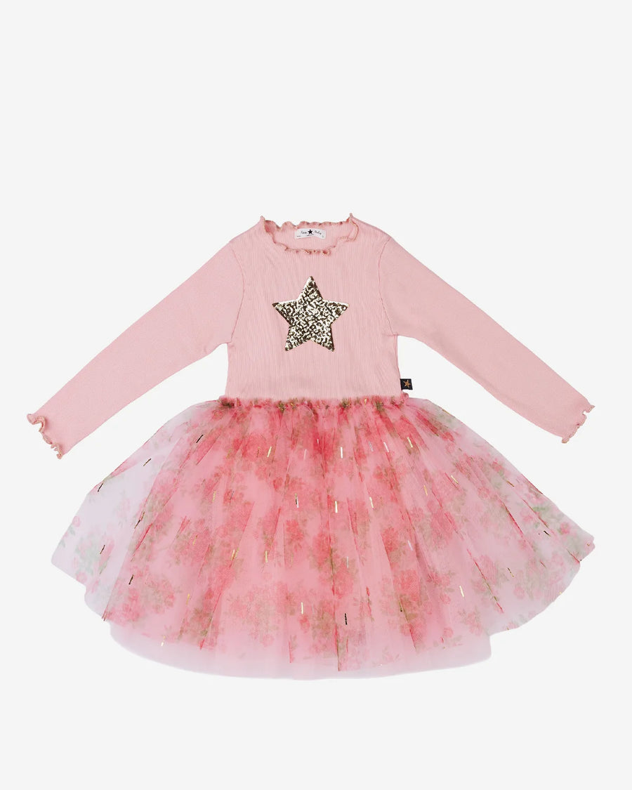 A pink long-sleeve baby dress with a sequined star on the chest and a layered tulle tutu skirt with a pink floral pattern, shown on a plain light gray background.