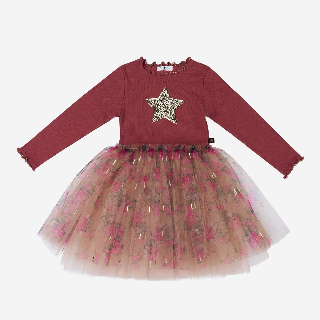 A toddler girl's long-sleeve dress featuring a dusty rose red top with a sequined star on the chest and a layered tulle tutu skirt in sheer pink and beige with gold sequins, shown on a plain light gray background.