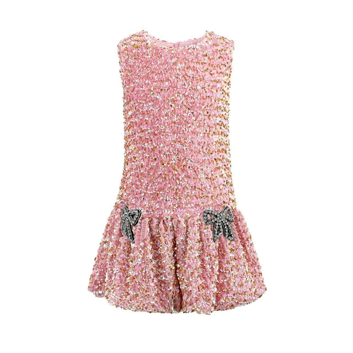 Pink sequin dress with bow details on a white background