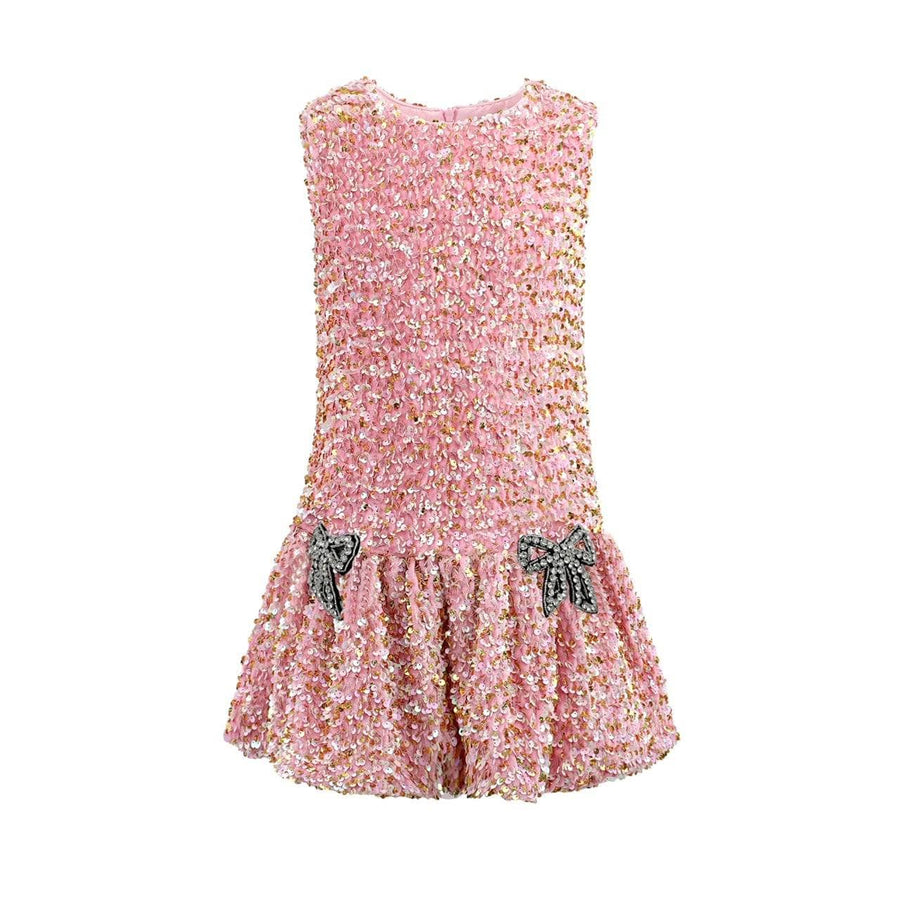 Pink sequin dress with bow details on a white background