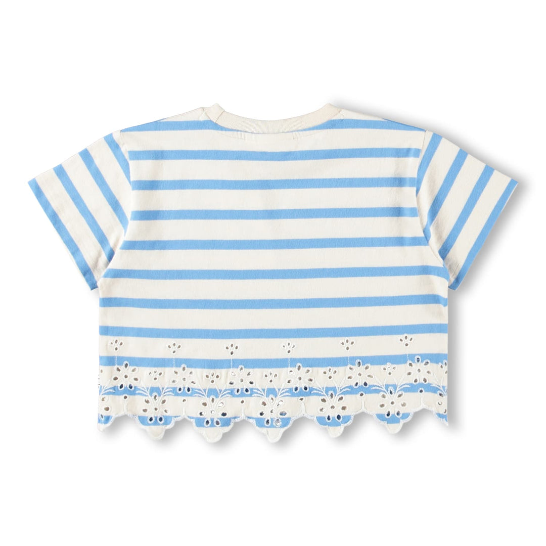 Blue and white striped shirt with scalloped hem on a white background