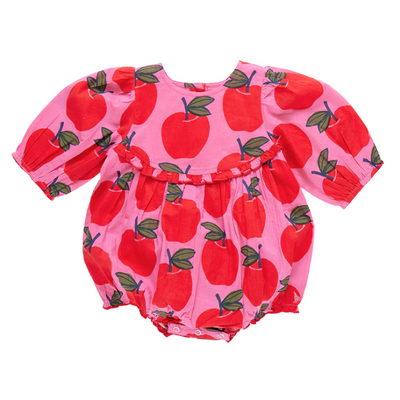 3/4 sleeve baby bubble bright pink background with big red apples all over. small ruffle at an empire waist. 