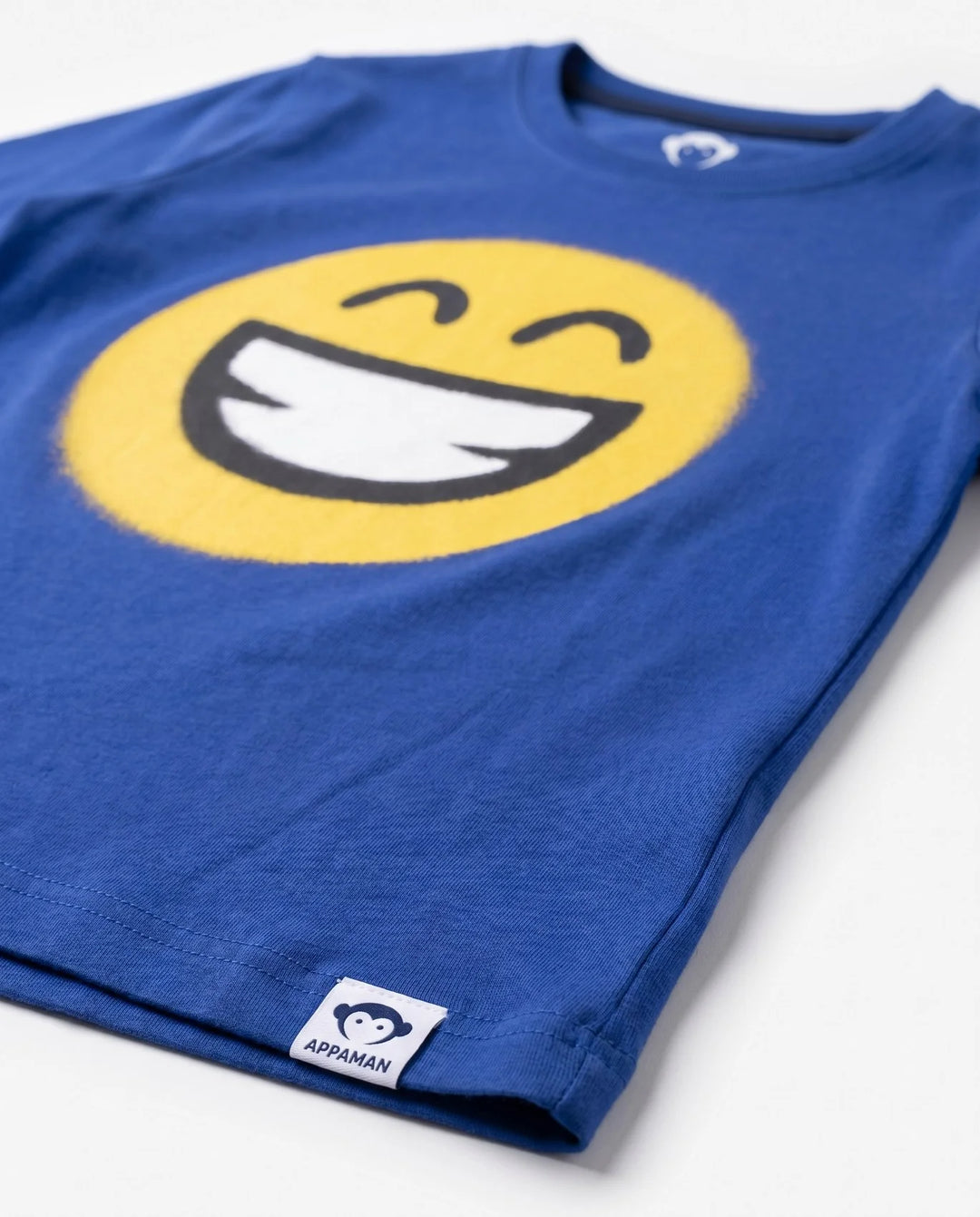 long sleeve royal blue tee with yellow smiley face on the front. 
