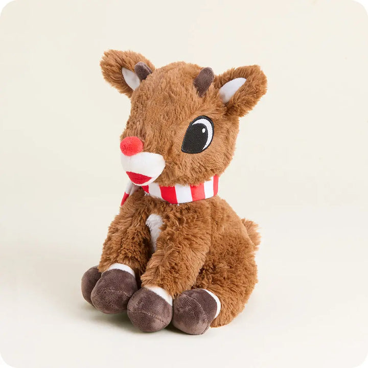 Plush reindeer toy with a red nose and scarf on a light background