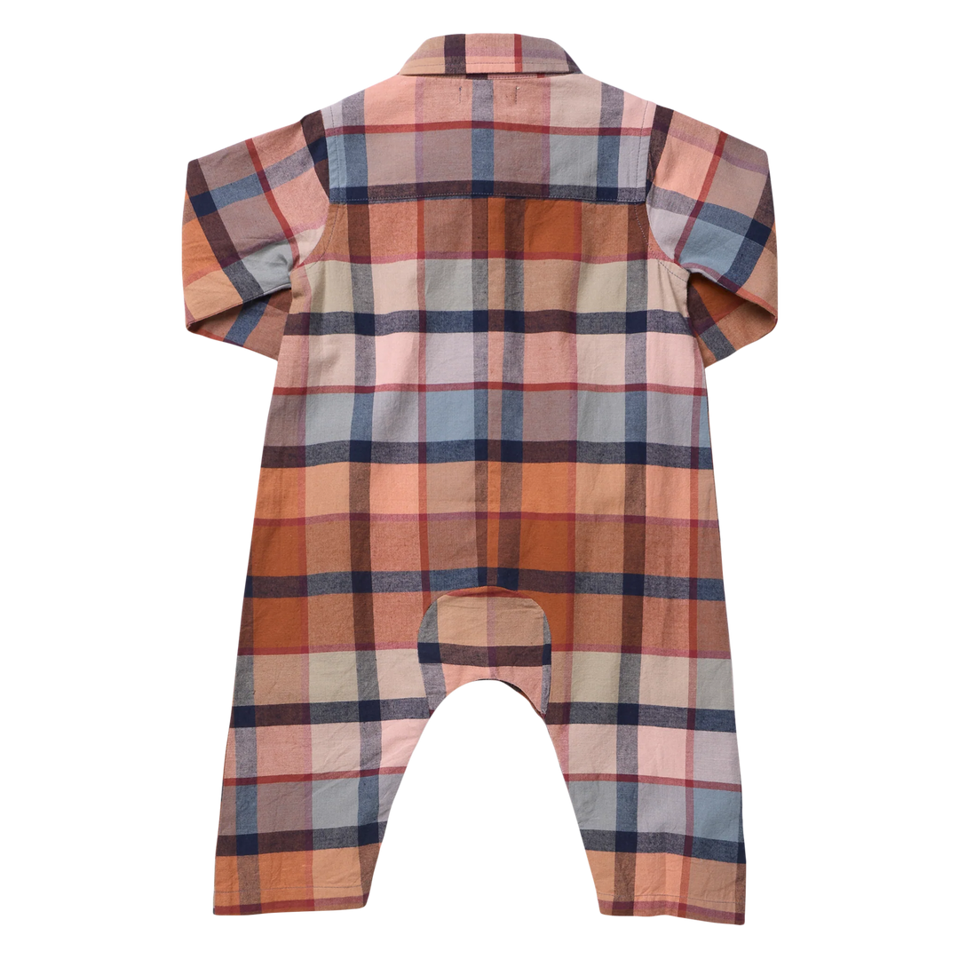 back of baby jumpsuit in a rust plaid 