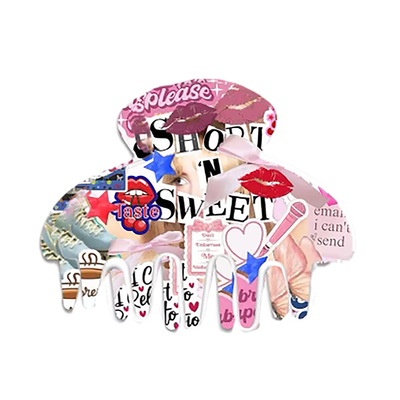 sabrina carpenter inspired claw clip with the words "short and sweet" and different sabrina inspired pictures all over it. 