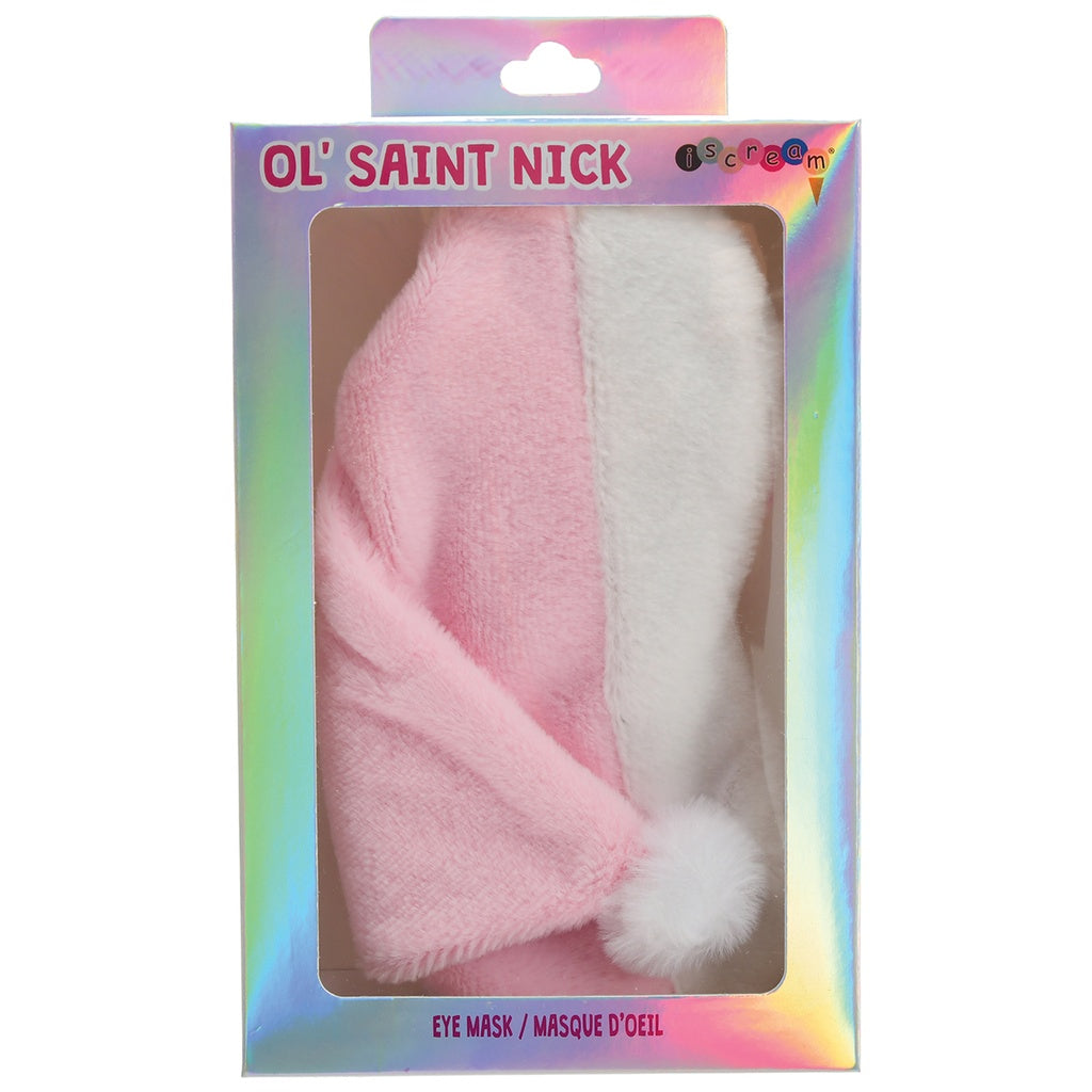 A pink and white fuzzy eye mask shaped like a Santa hat, displayed inside its holographic packaging box labeled 'Ol' Saint Nick' and 'Eye Mask'.
