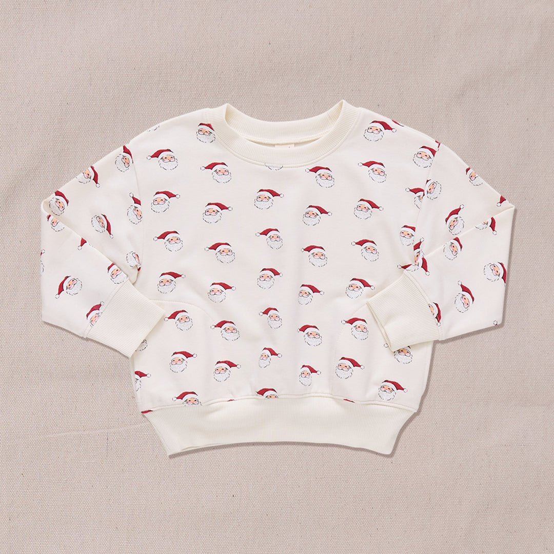 crewneck sweatshirt in ivory with small santa print all over it. 