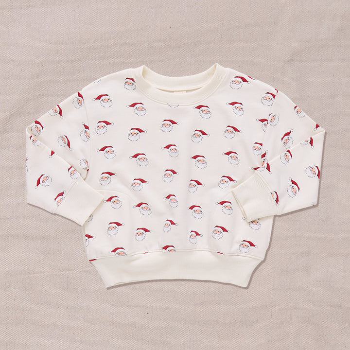 crewneck sweatshirt in ivory with small santa print all over it. 