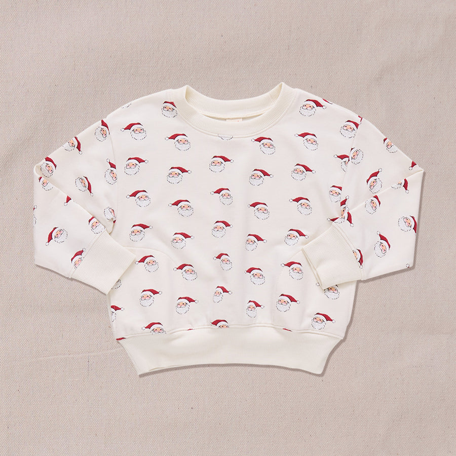 crewneck sweatshirt in ivory with small santa print all over it. 