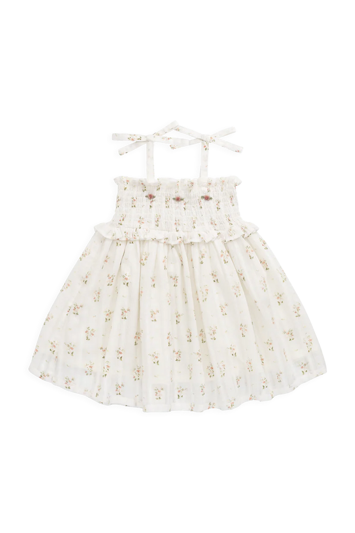 White dress with floral embroidery on a white background