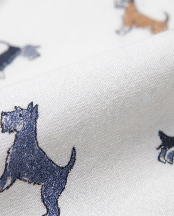 close up of white shirt with multi color scotty dogs on it. 