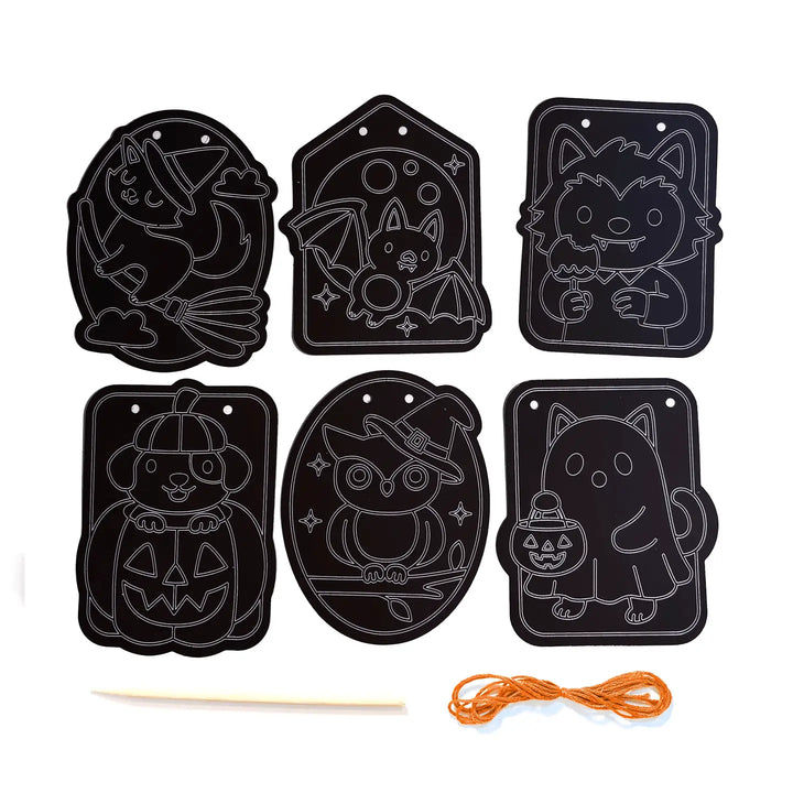 Six black Halloween-themed craft stencil templates with white outline drawings of a witch, bat, wolf, pumpkin, owl, and ghost, shown on a white background with a wooden stick and orange thread.