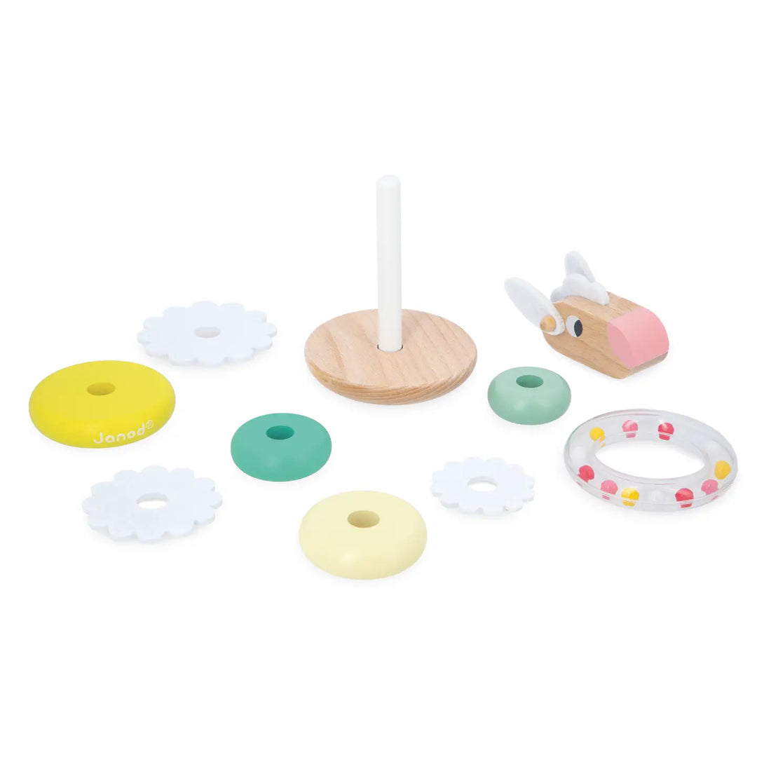 Colorful wooden toy set with rings and a stand on a white background