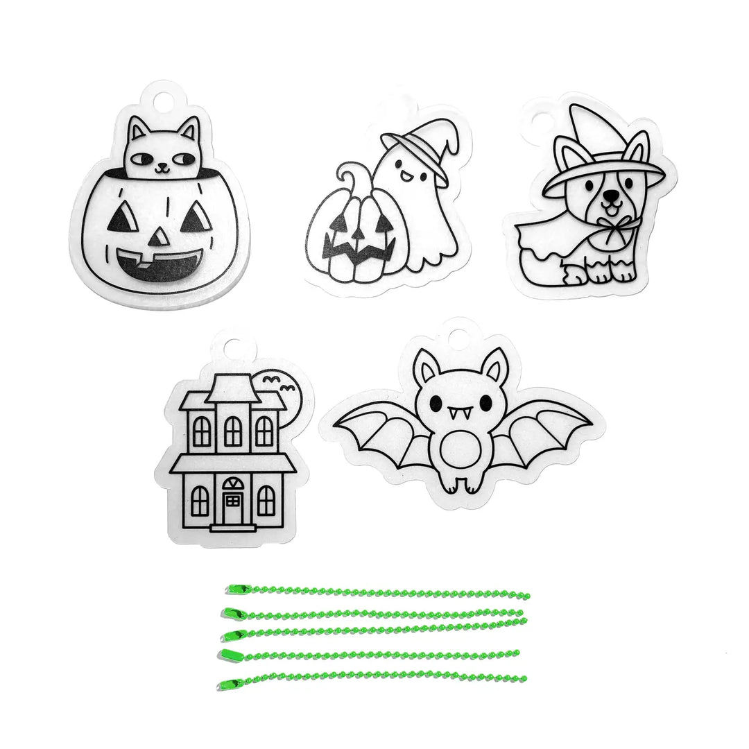 Set of Halloween-themed stickers including a cat in a pumpkin, ghost with a pumpkin, dog in a witch hat, bat, haunted house, and green lanyards on a white background.