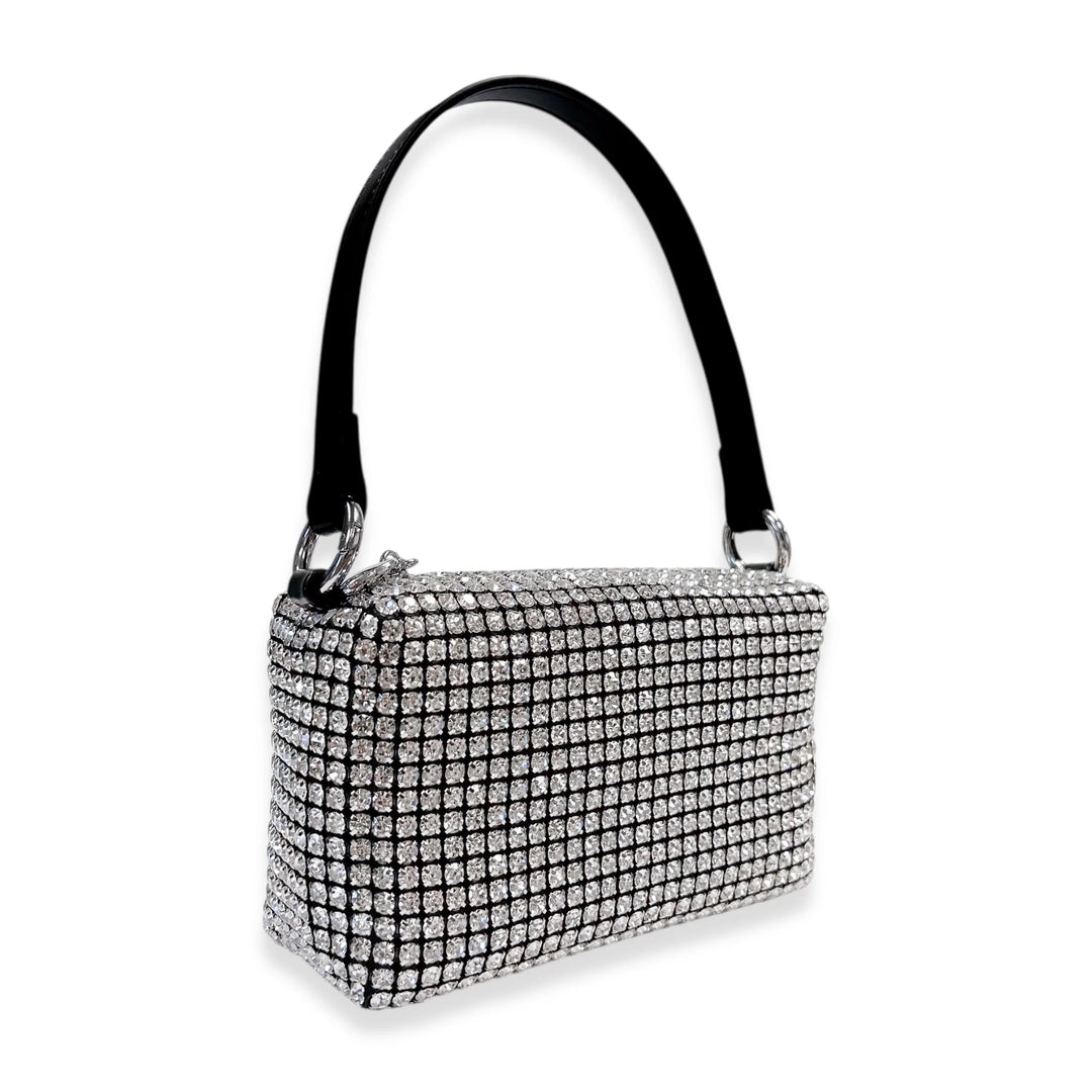 Silver handbag with rhinestone embellishments on a white background