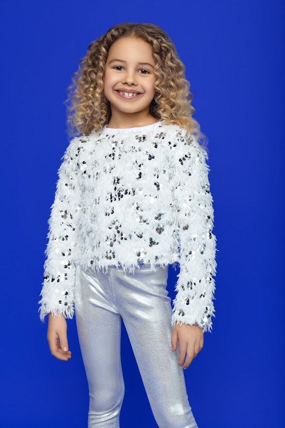 young girl modeling a fuzzy sweater and our metallic silver leggings 