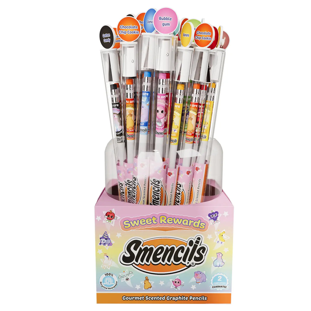 A display stand filled with assorted scented graphite pencils in a pink box labeled 'Sweet Rewards Smencils Gourmet Scented Graphite Pencils'.