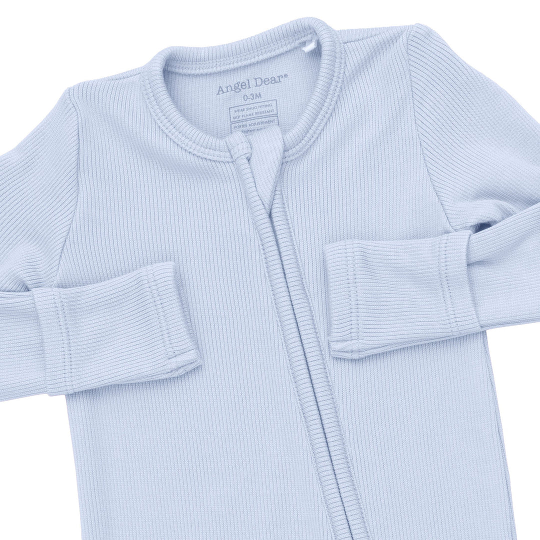 Light blue baby onesie with a zipper on a white background