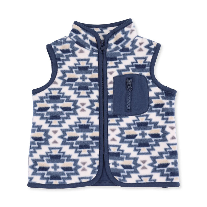 A sleeveless zip-front fleece vest with a geometric Southwestern pattern in navy blue, white, and light beige, featuring a solid navy blue chest pocket.