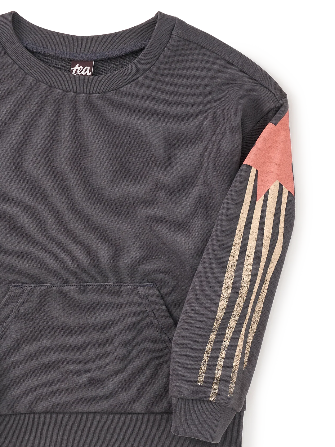 Close-up of a dark charcoal gray sweatshirt with a front kangaroo pocket and a sleeve design featuring a coral pink star and three vertical metallic gold stripes.
