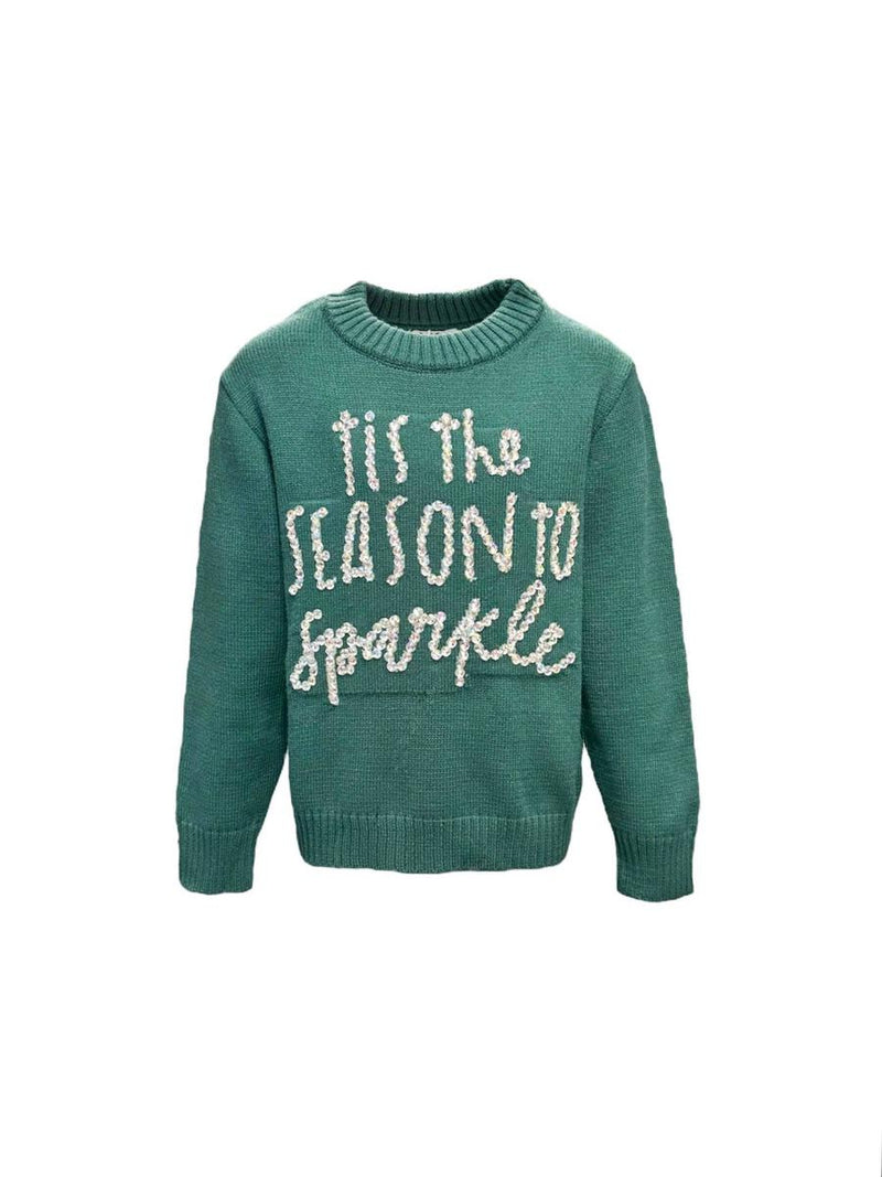 green sweater that reads "Tis the Season to Sparkle" in rhinestones. 