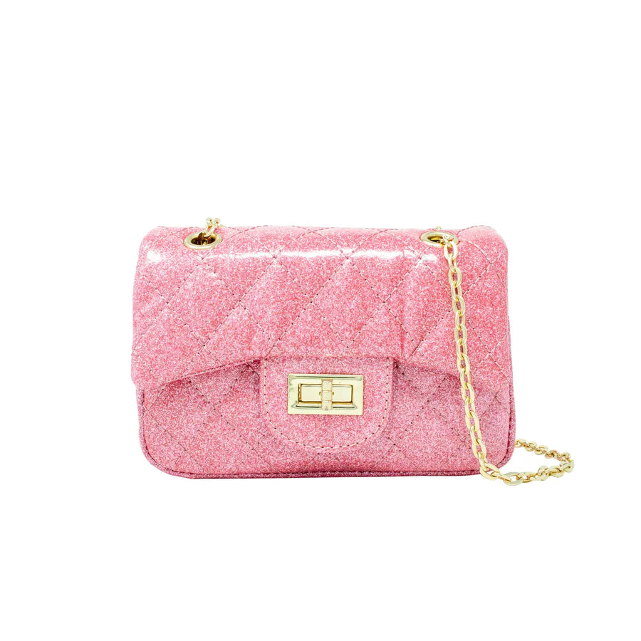 A pink quilted glitter shoulder bag with a gold-tone turn-lock clasp and a gold chain strap, shown on a plain white background.
