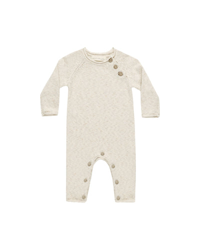 baby knit jumpsuit, speckled natural beige color with 3 buttons at the neck and buttons at crotch. 