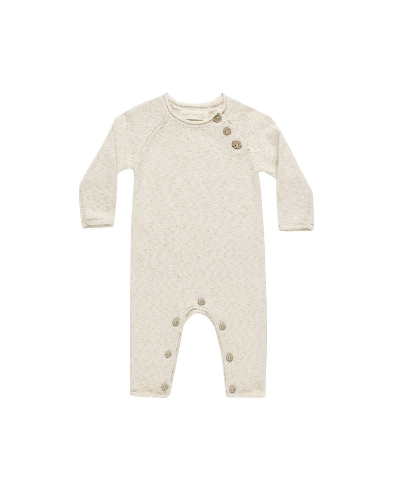 baby knit jumpsuit, speckled natural beige color with 3 buttons at the neck and buttons at crotch. 