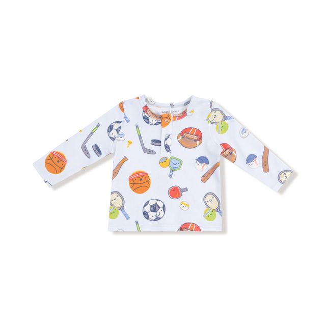 Children's long-sleeve shirt with sports-themed pattern on a white background