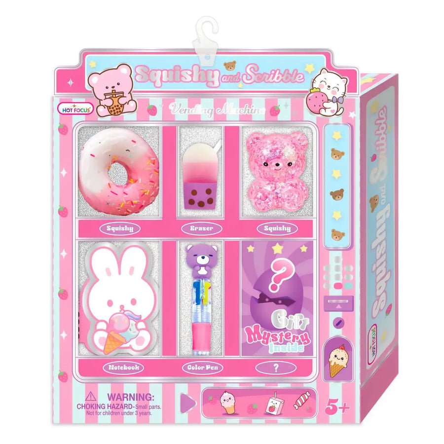 A pink 'Squishy and Scribble' kids'  kit in its retail packaging, featuring a variety of colorful drawing and play tools including a donut-shaped squishy, a glittery crayon, a pink bear squishy, a bunny eraser, and a mystery panel.