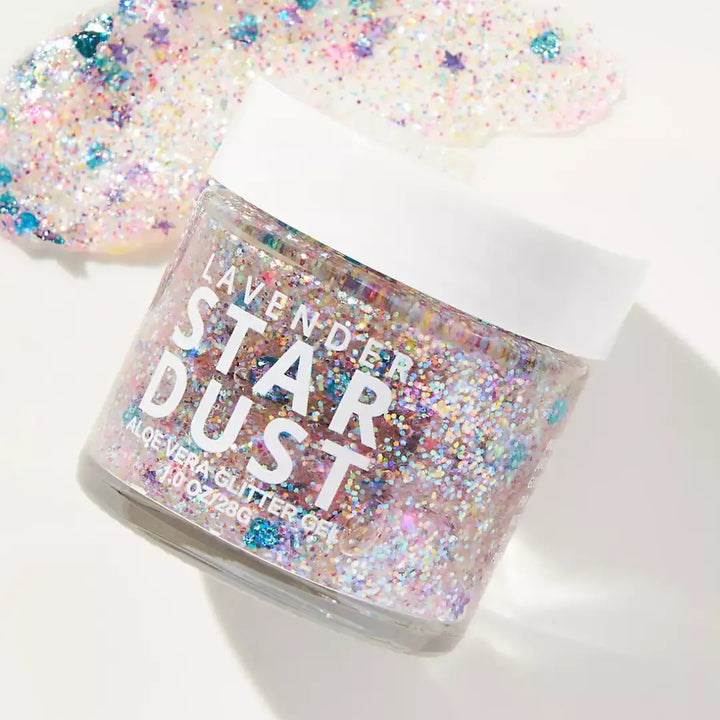 Jar of 'Star Dust' glitter with colorful star-shaped glitter on a white background