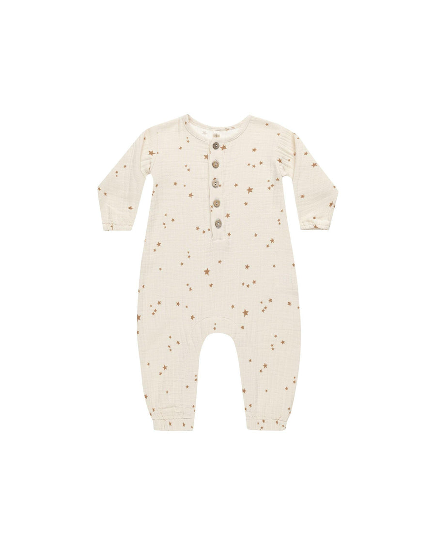 baby woven jumpsuit. beige in color with all over star print. 