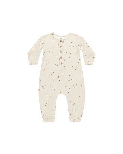 baby woven jumpsuit. beige in color with all over star print. 