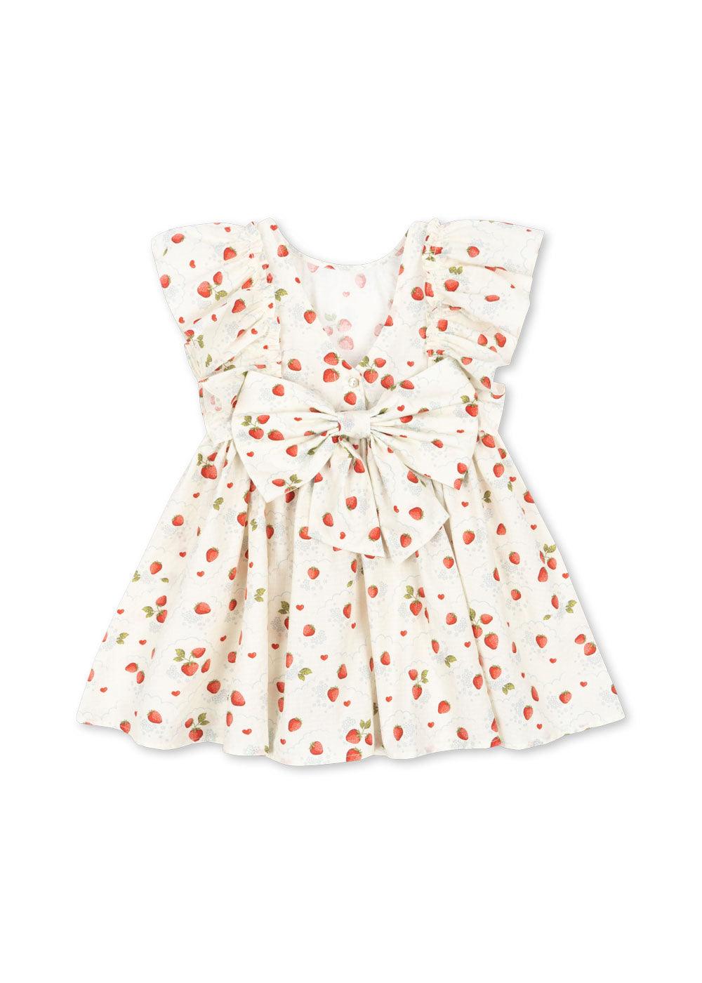 picture of the back of the dress with ruffles at the side and a big bow in the back of the dress. 