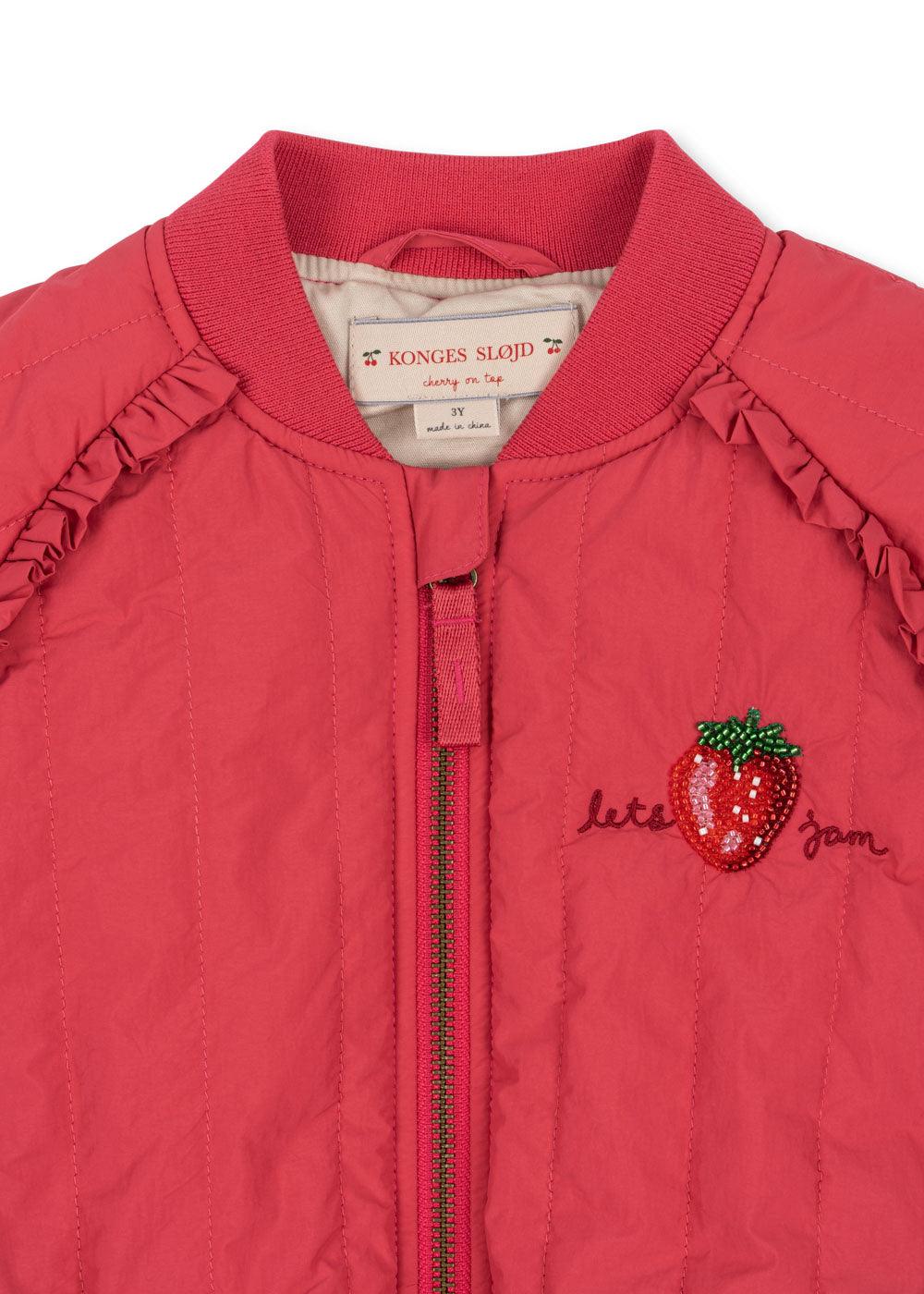 close up of beaded strawberry with "lets jam" written on the side of the strawberry. 