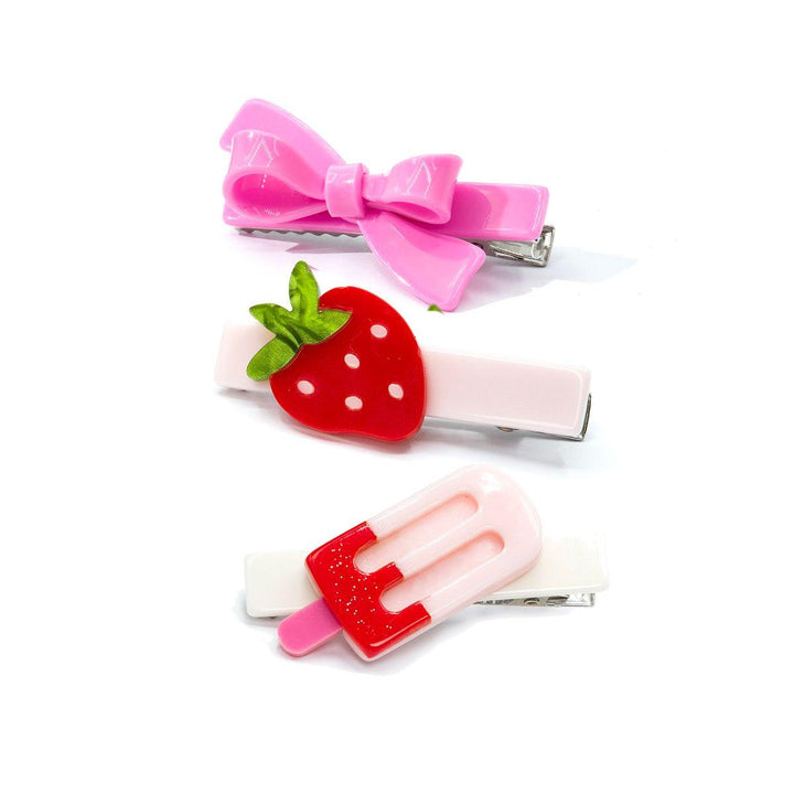 set of 3 hair clips: one with a strawberry, one with a popsicle and one pink bow. 