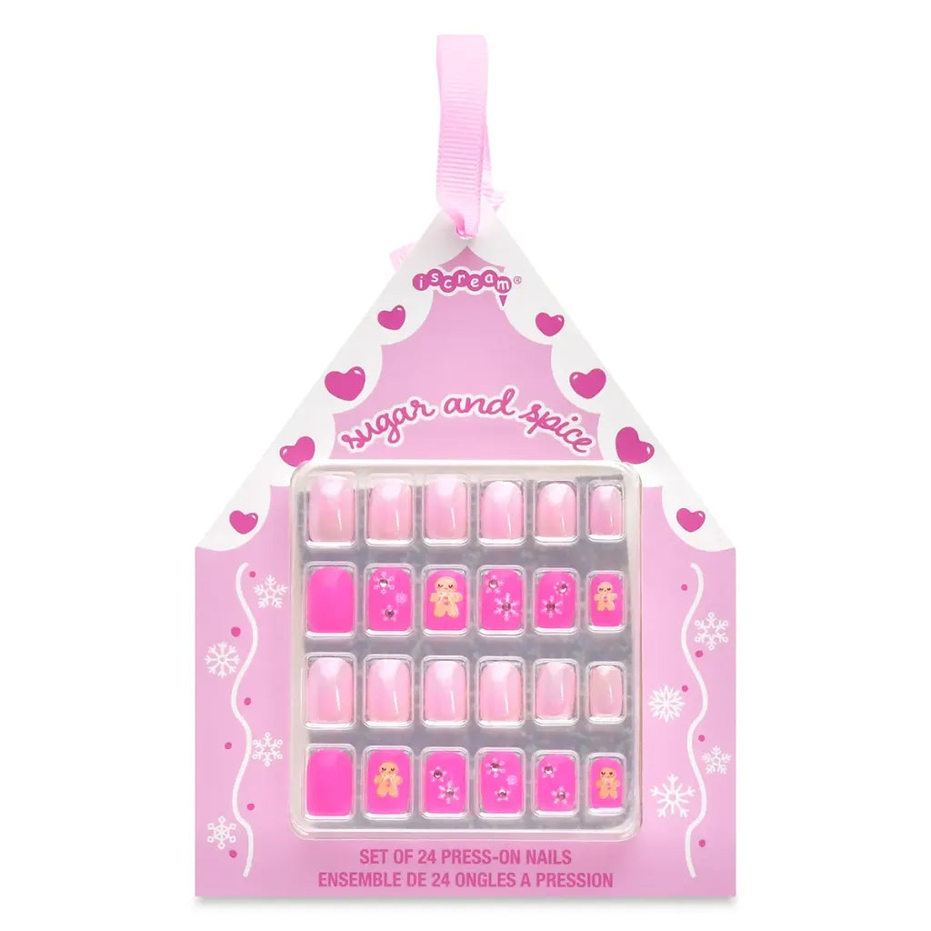 A pink house-shaped retail package containing a set of 24 press-on nails. The packaging is decorated with pink hearts, white swirls, and the text 'sugar and spice' and 'SET OF 24 PRESS-ON NAILS'.