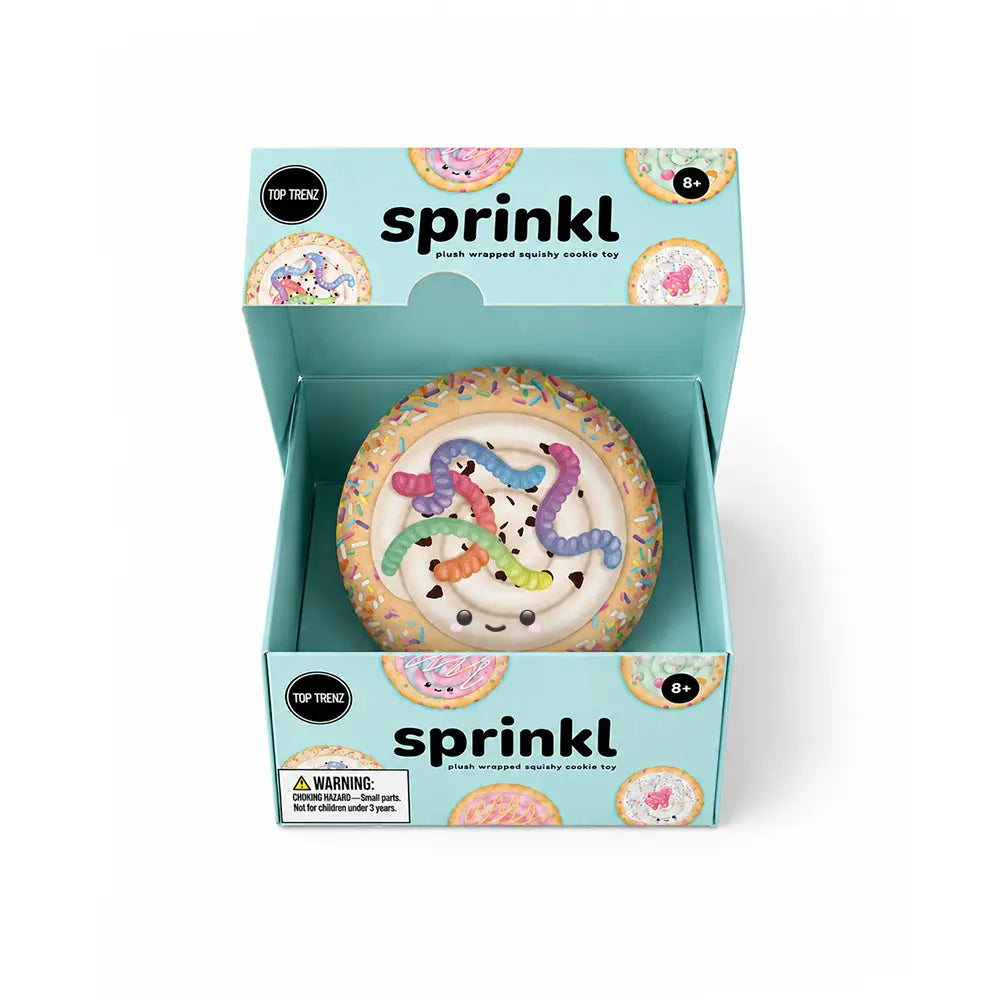 A packaged squishy toy shaped like a donut with colorful snake characters, shown inside an open mint-blue box labeled 'sprinkl'.