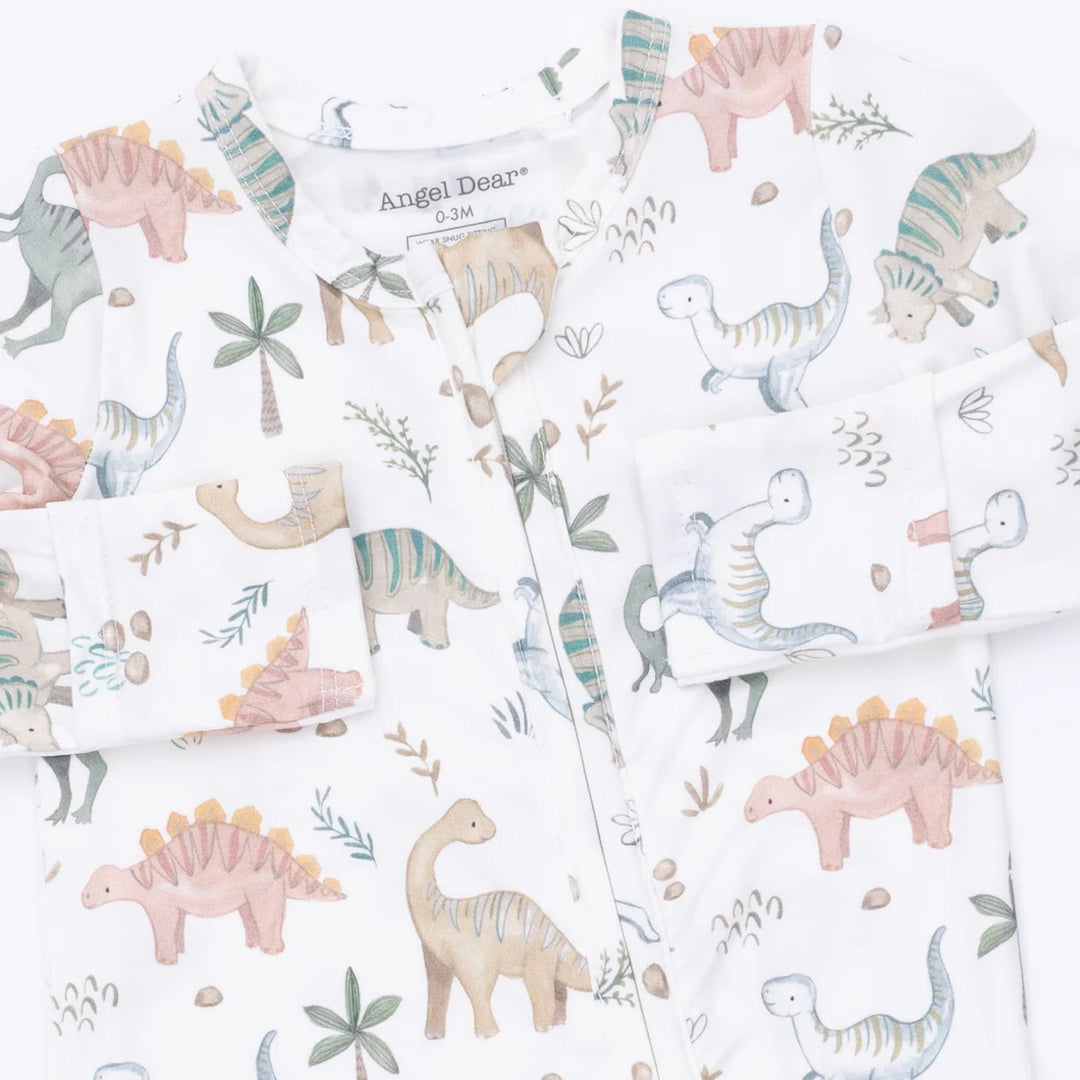 A children's long-sleeve pajama footie by Angel Dear, featuring a white base with a colorful dinosaur print including Stegosaurus, Triceratops, and Brachiosaurus in soft pastel tones.