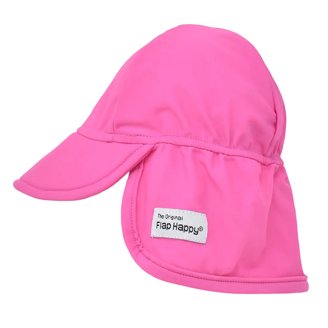 Pink sun hat with a Flap Happy label on a white background